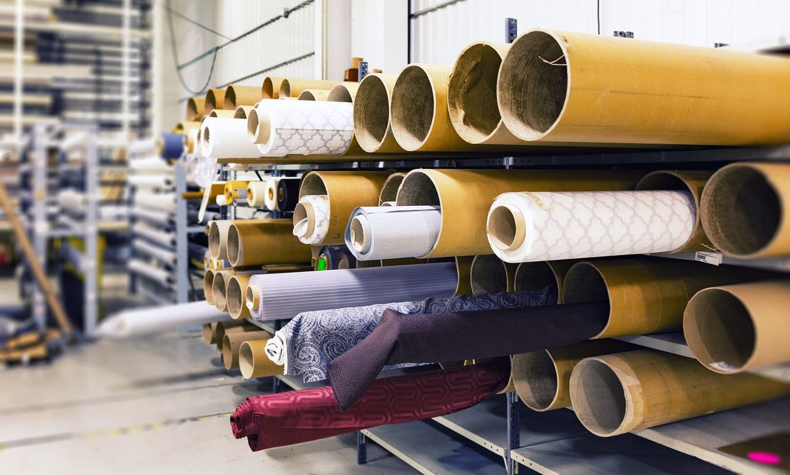 Textile rolls stored in an industrial warehouse
